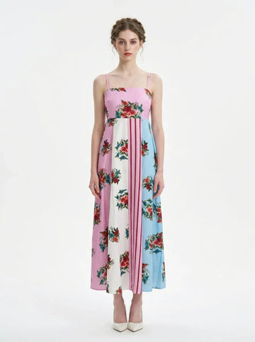 Woman wearing a colorblock floral print maxi dress with spaghetti straps