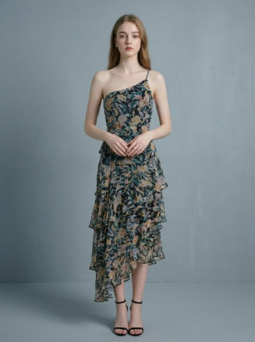 Woman wearing a floral print one-shoulder chiffon dress with a tiered, asymmetrical ruffle skirt.