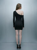 Back view of a woman in a black asymmetrical mini dress with one long sleeve.