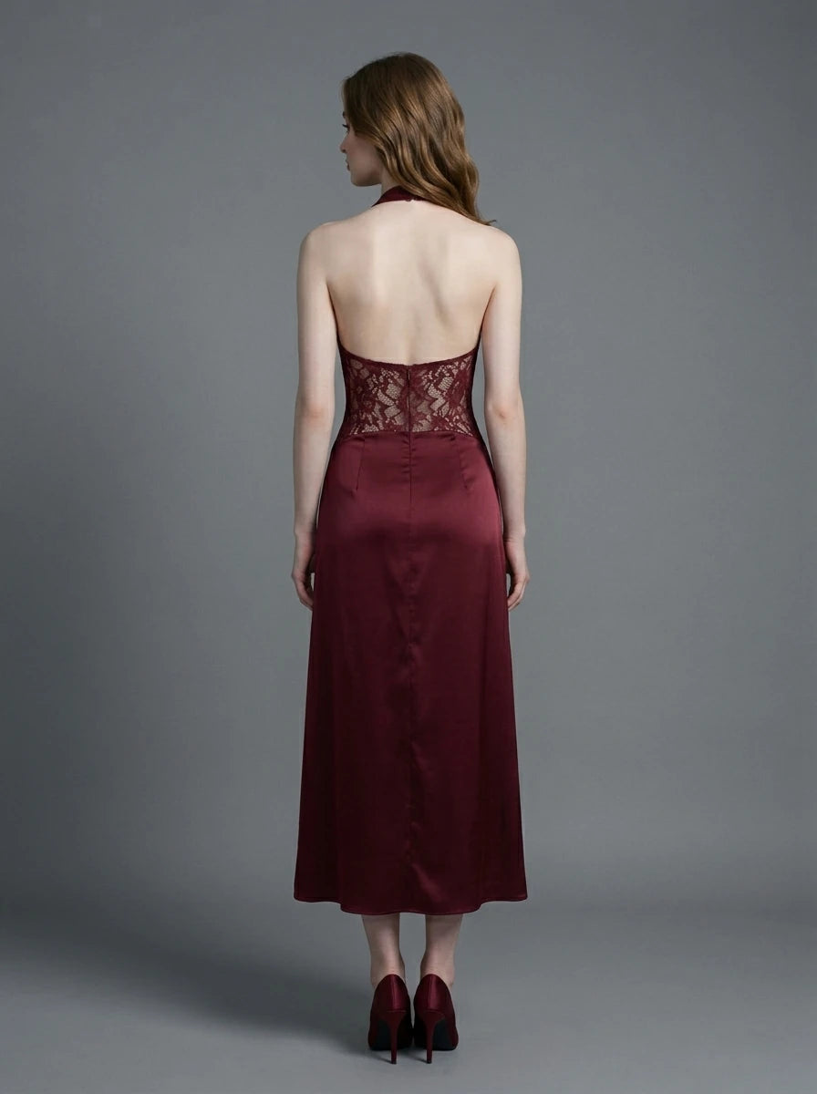 Woman wearing a burgundy lace and satin halter neck dress
