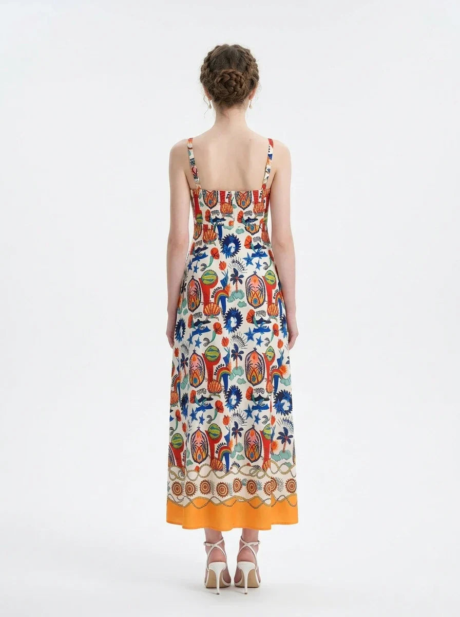 Back view of a woman in a colorful printed A-line midi dress.