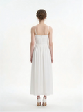 Back view of a woman in a white halter neck midi dress