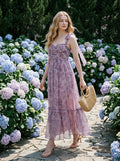 Woman in a floral print dress walking outdoors
