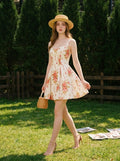 Woman wearing a white floral print A-line dress with a sweetheart neckline and adjustable shoulder straps, holding a straw hat and a basket bag, walking in a garden.