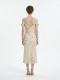 back view of a floral print cold shoulder midi dress