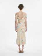 back view of a floral print cold shoulder midi dress