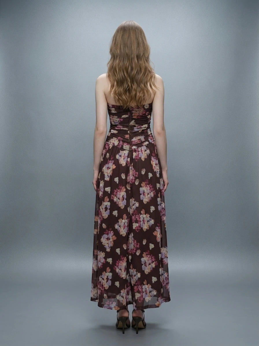 Woman wearing a strapless floral print chiffon maxi dress