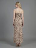 Back view of a woman in a strapless geometric print maxi dress