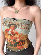 Close-up of the graphic print on a strapless tube top featuring a cowboy illustration.