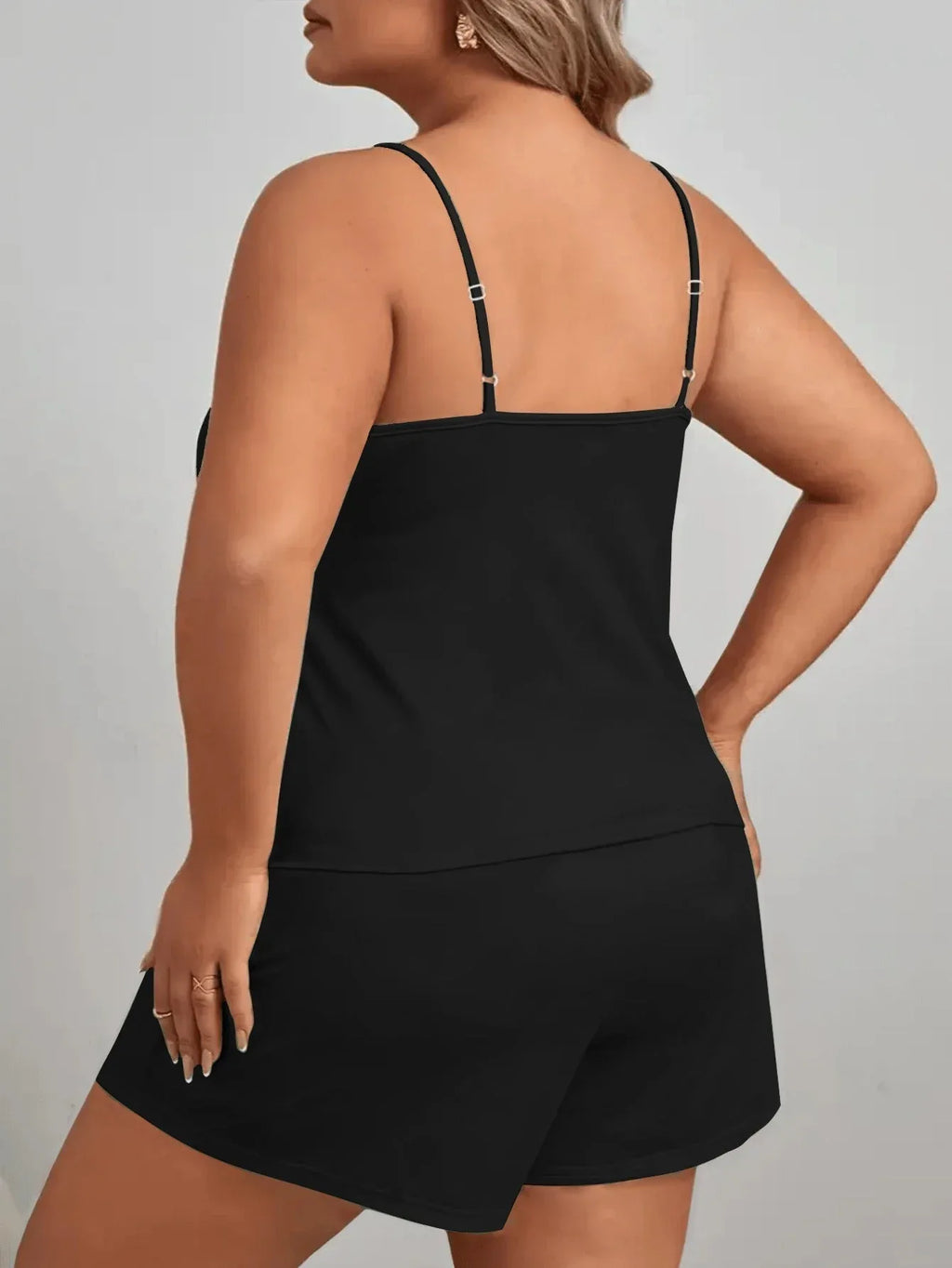 Back view of a black pajama set with spaghetti straps