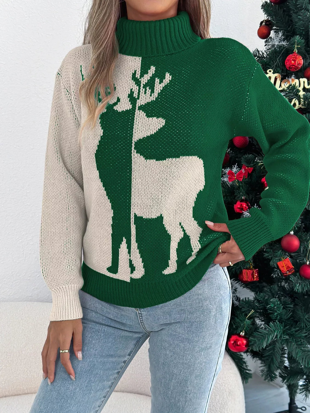 Model posing in a color block holiday sweater