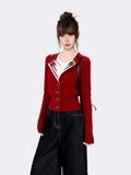 Woman in red knit cardigan with striped lapel and bronze buttons