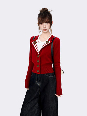 Woman in red knit cardigan with striped lapel and bronze buttons