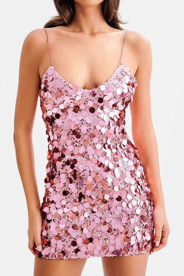 Woman wearing a pink sequined mini dress with spaghetti straps Main image