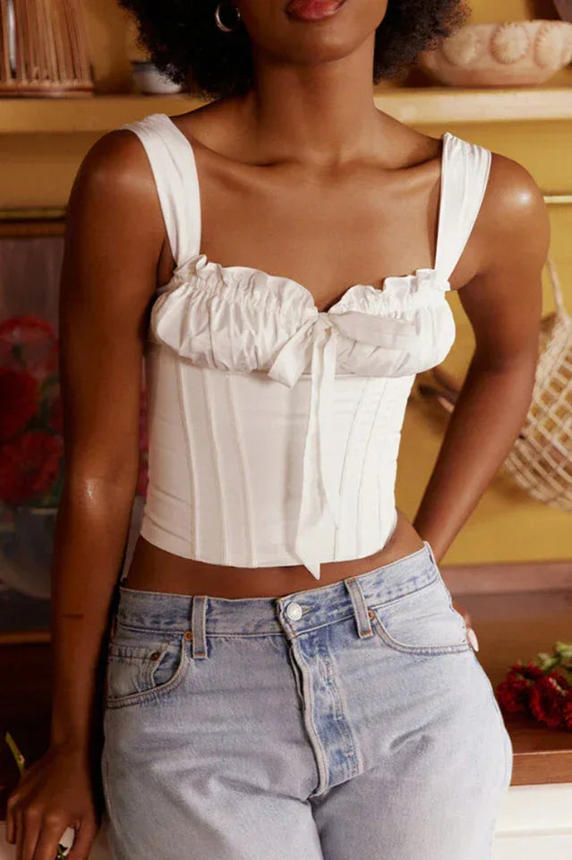Front view of a white satin corset top with a square neckline