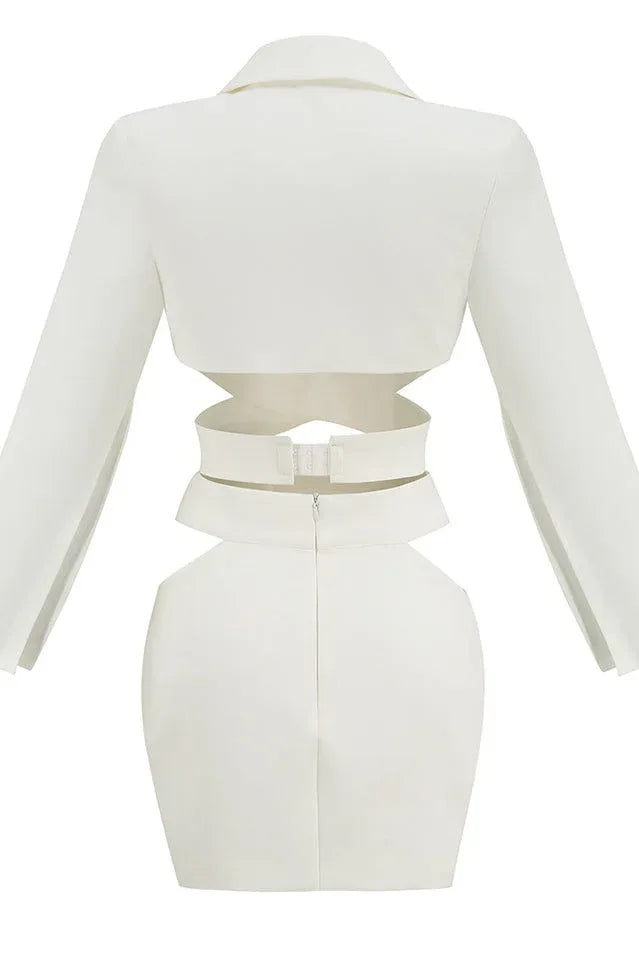 Back view of a white women's two-piece set featuring a crop top with cut-outs and a mini skirt.