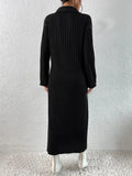 Back view of a model in a black ribbed knit midi dress with long sleeves.