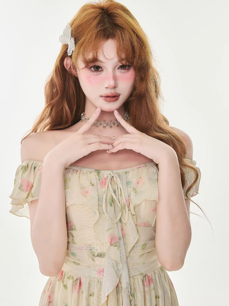 Woman wearing a cream floral print chiffon mini dress with ruffle trim and a tie-front detail.