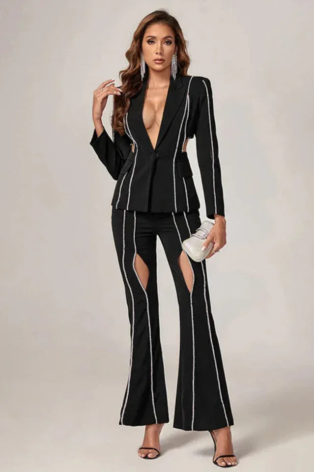 Model posing in a black tailored blazer with cut-outs