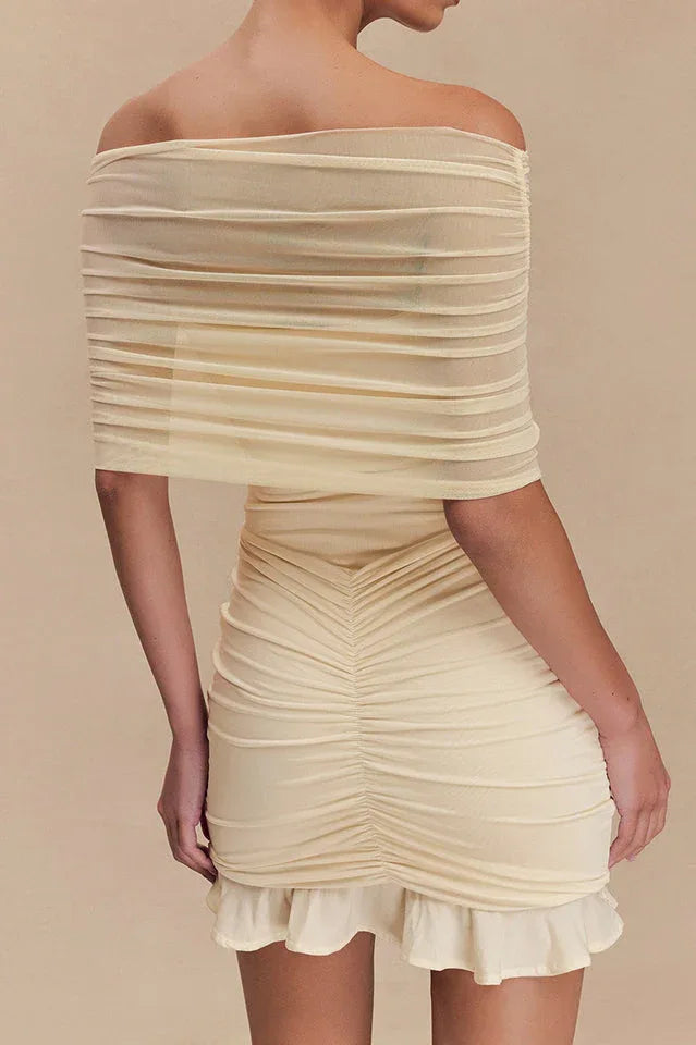 Back view of cream off-the-shoulder ruched bodycon dress