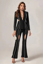 Close-up of crystal details on a black pantsuit