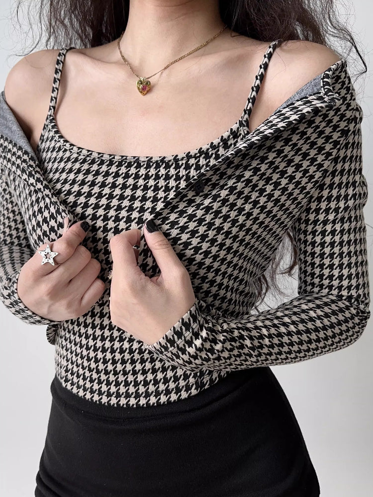 Close-up of a woman wearing a houndstooth print camisole with a cardigan draped off the shoulders.