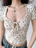 Cream floral print short sleeve top with sweetheart neckline.