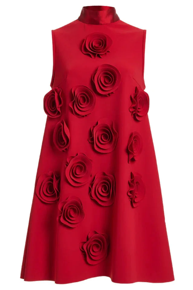 Close-up of the front of a red sleeveless A-line dress adorned with multiple 3D rose appliques.