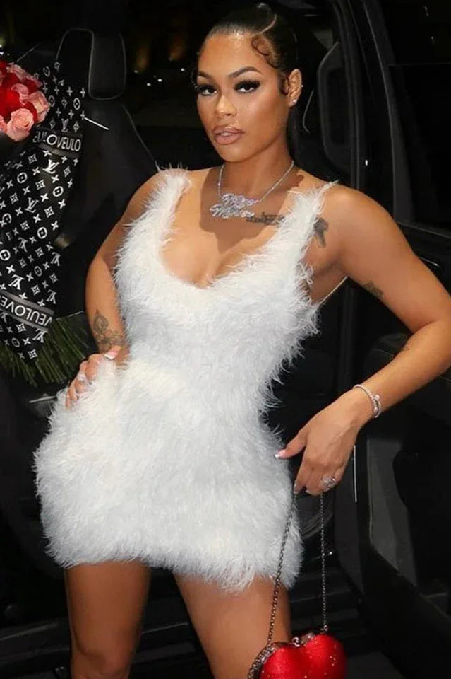 Woman wearing a white feather trim mini dress
