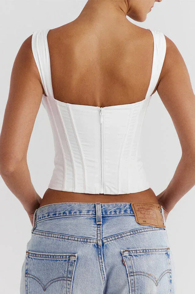 Back view of a white satin corset top with zipper closure