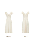 Front view of a cream-colored jacquard midi dress with off-the-shoulder neckline and ruched detailing.