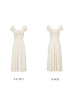 Front view of a cream-colored jacquard midi dress with off-the-shoulder neckline and ruched detailing.