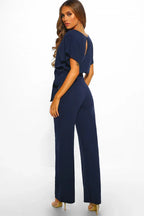 Orange wide leg jumpsuit with tie waist and boat neckline