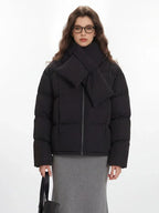 Close-up of a black puffer jacket with a scarf