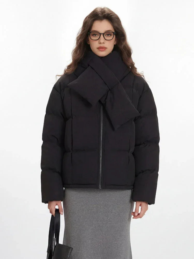 Close-up of a black puffer jacket with a scarf