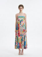 Woman wearing a colorful patchwork print maxi dress with spaghetti straps