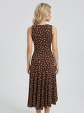 Back view of a woman in a brown polka dot sleeveless midi dress