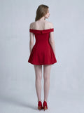 Back view of a woman in a red off-the-shoulder dress