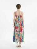 Back view of a woman in a patchwork print maxi dress