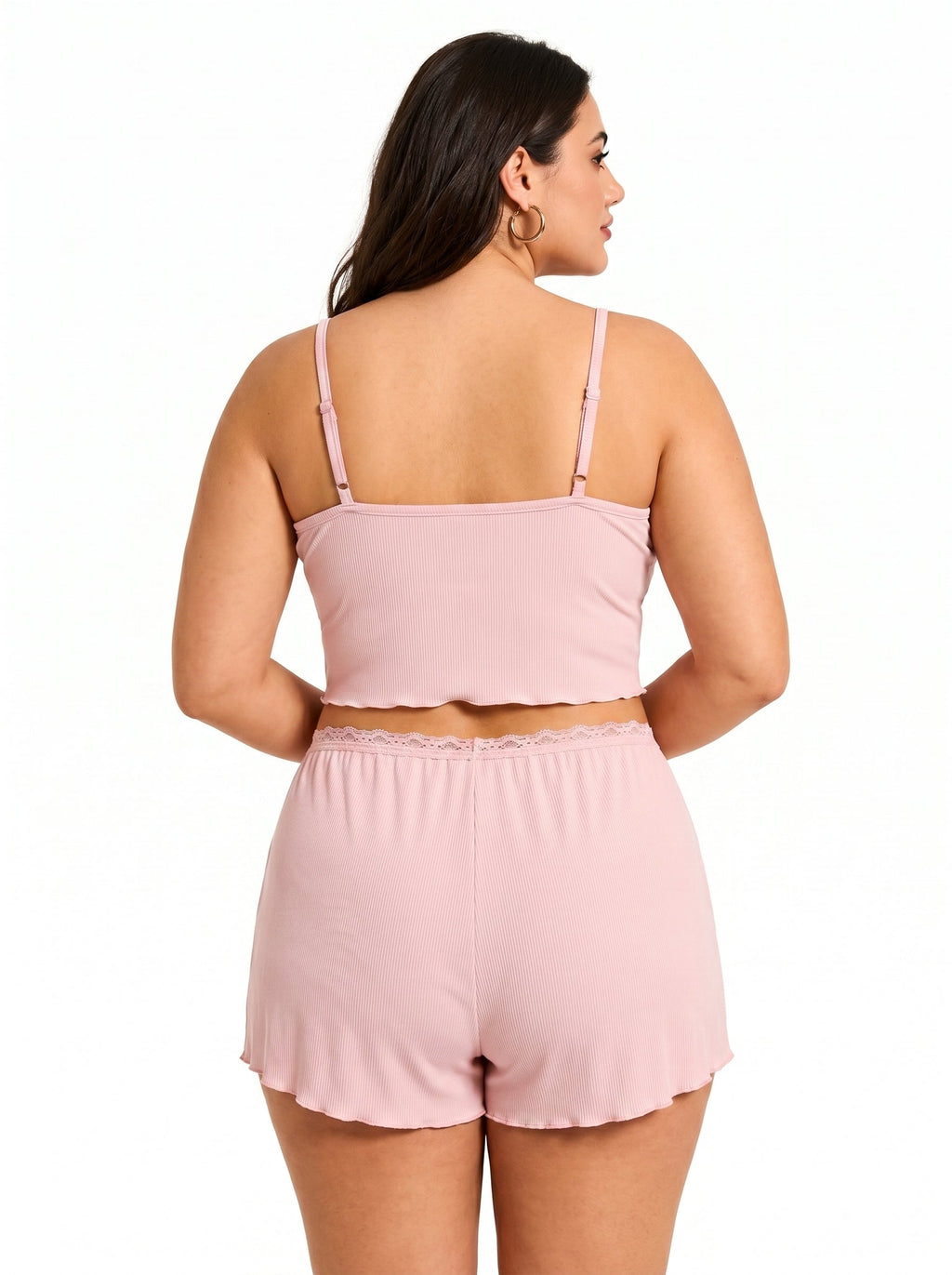 Back view of a plus-size woman in a pink ribbed knit pajama set