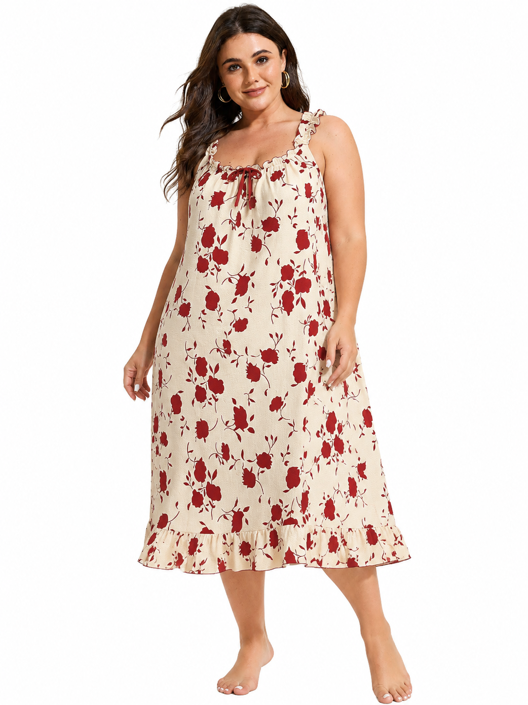 Model wearing a cream and red floral print nightgown with ruffled straps and hem.