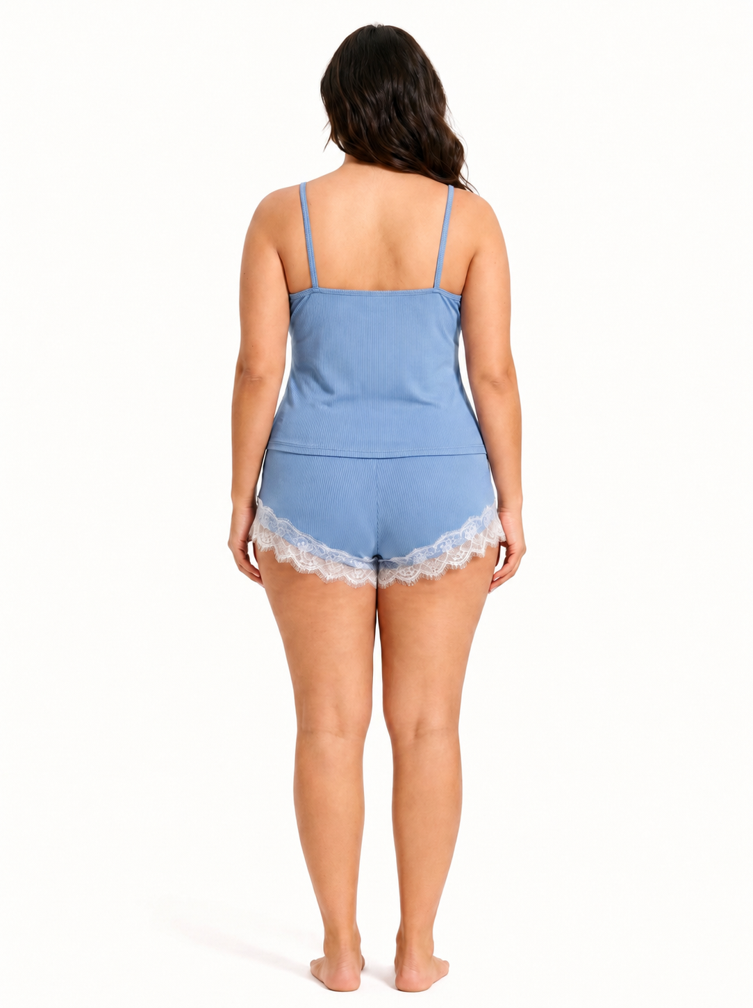 Back view of a woman in a light blue ribbed knit camisole and shorts set with white lace trim.
