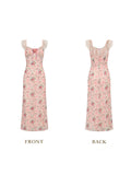 Front view of a pink floral print midi dress with lace trim and a tie detail.