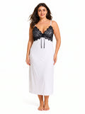 Woman wearing a white slip dress with a black lace bodice