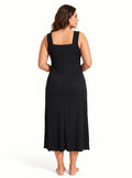Back view of a woman in a black sleeveless ribbed knit nightgown