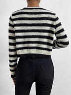 Back view of a black and white striped knit cardigan