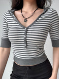 Detail shot of the neckline and buttons on a striped cropped knit top
