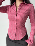 Close-up of a pink striped fitted shirt with button-down front.