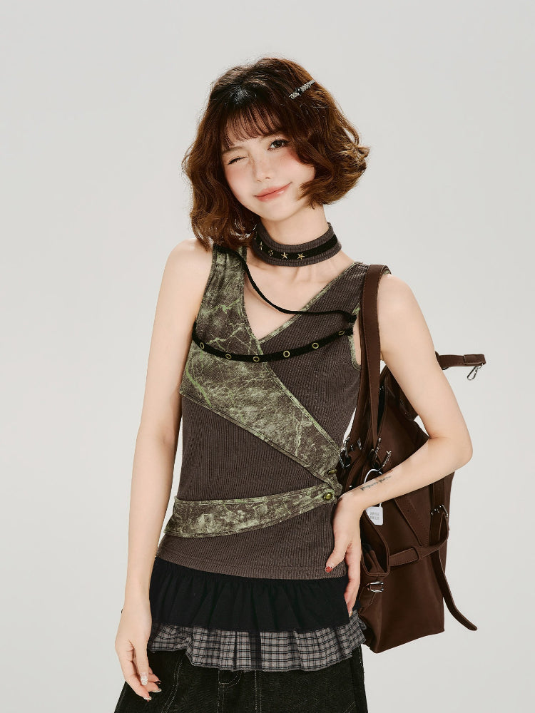 Model wearing a brown ribbed knit tank top with green textured print panels and decorative grommets