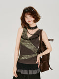 Close-up of the asymmetrical neckline and strap details on the tank top